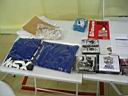 Produtos a venda, camisas, CDs de musicas, Colet�neas, adesivos, pins e at� livros de Linux.